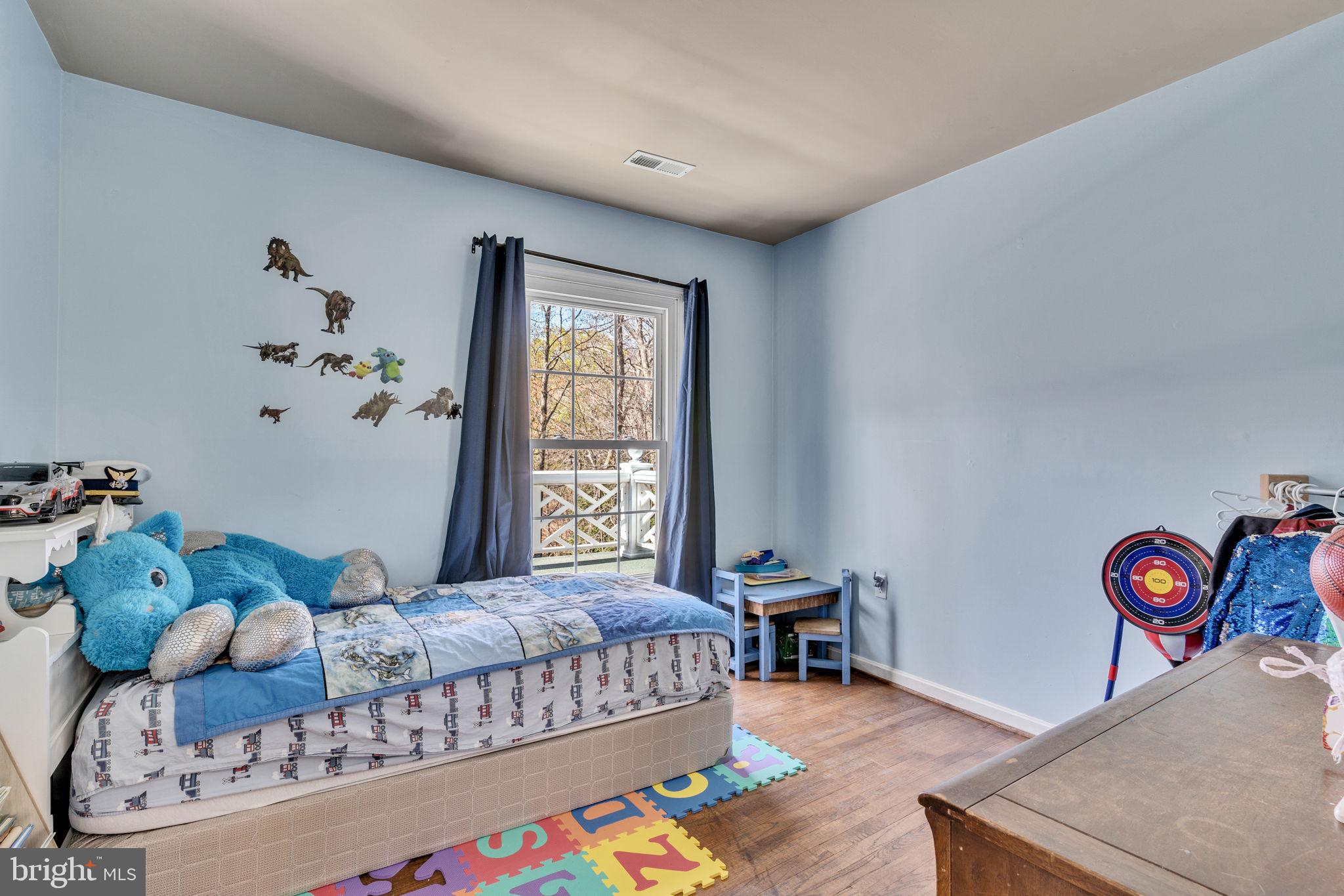 10231 3 Doctors Road Dunkirk, MD 20754 - Photo 33 of 63 a bedroom with a bed and a window