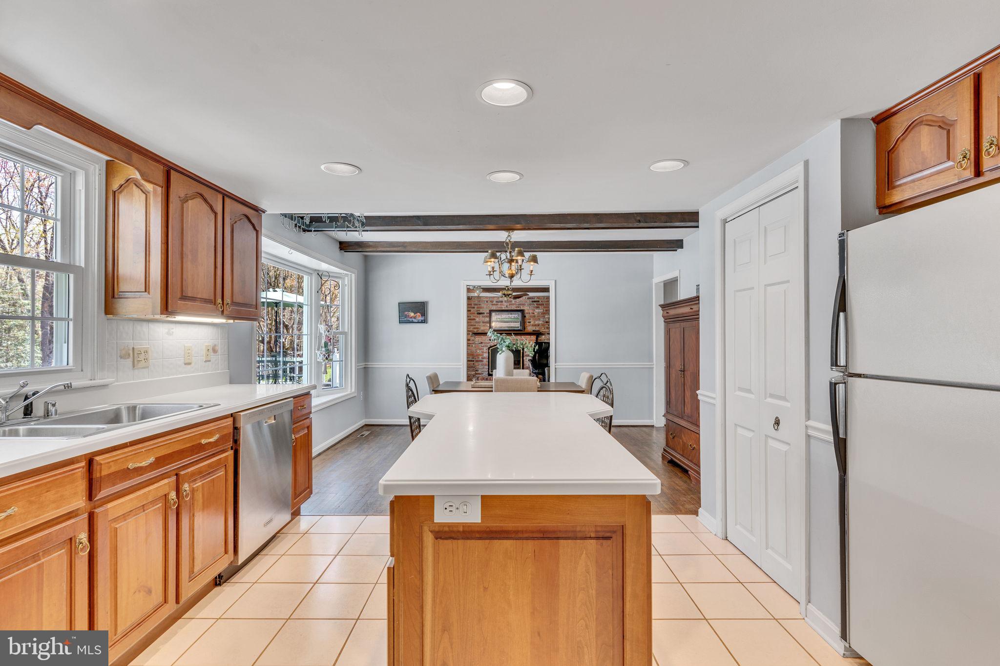 10231 3 Doctors Road Dunkirk, MD 20754 - Photo 5 of 63 a kitchen with granite countertop a refrigerator and a sink