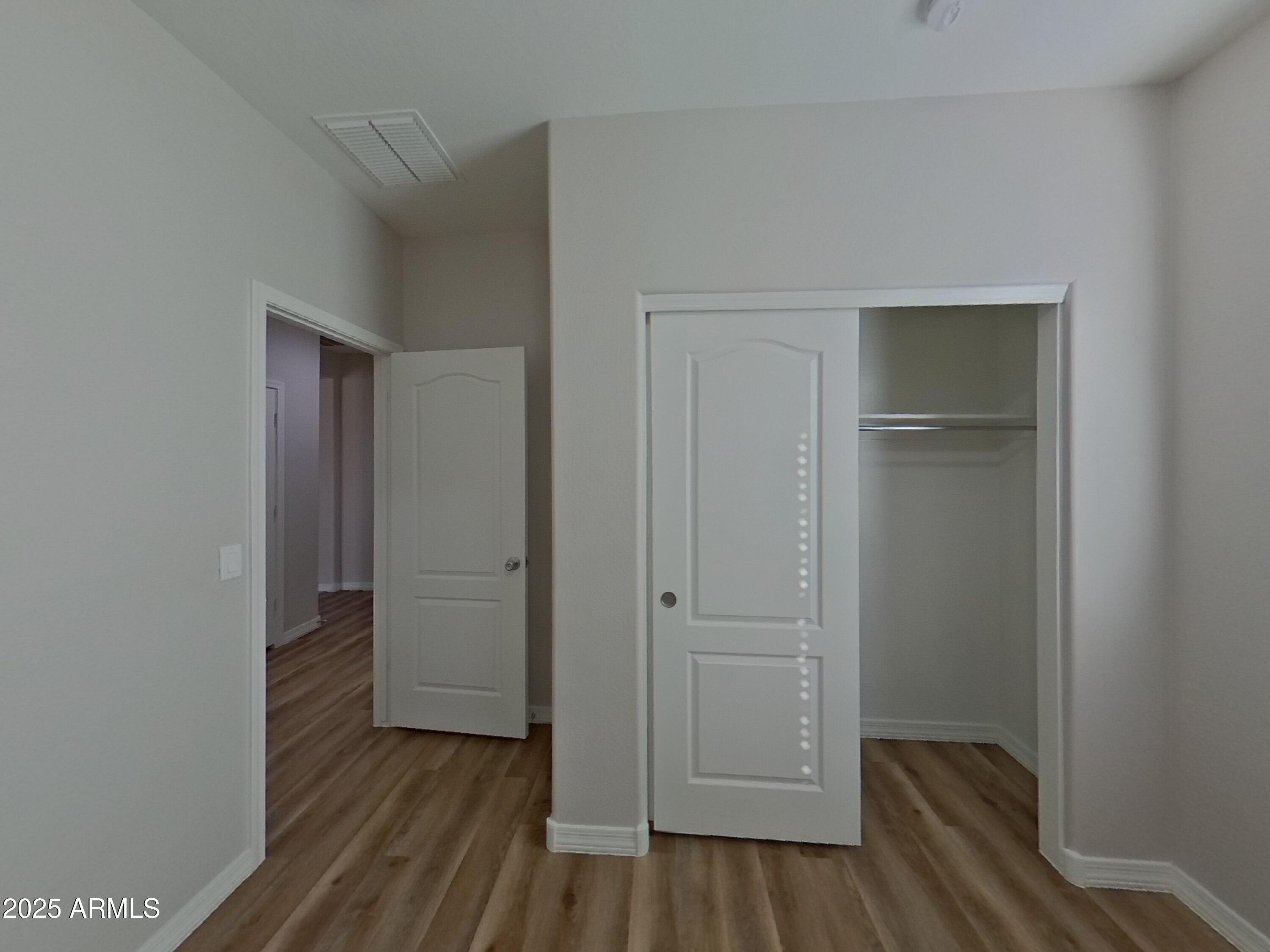 40209 Walker Way Maricopa, AZ 85138 - Photo 12 of 16 a view of hallway with wooden floor