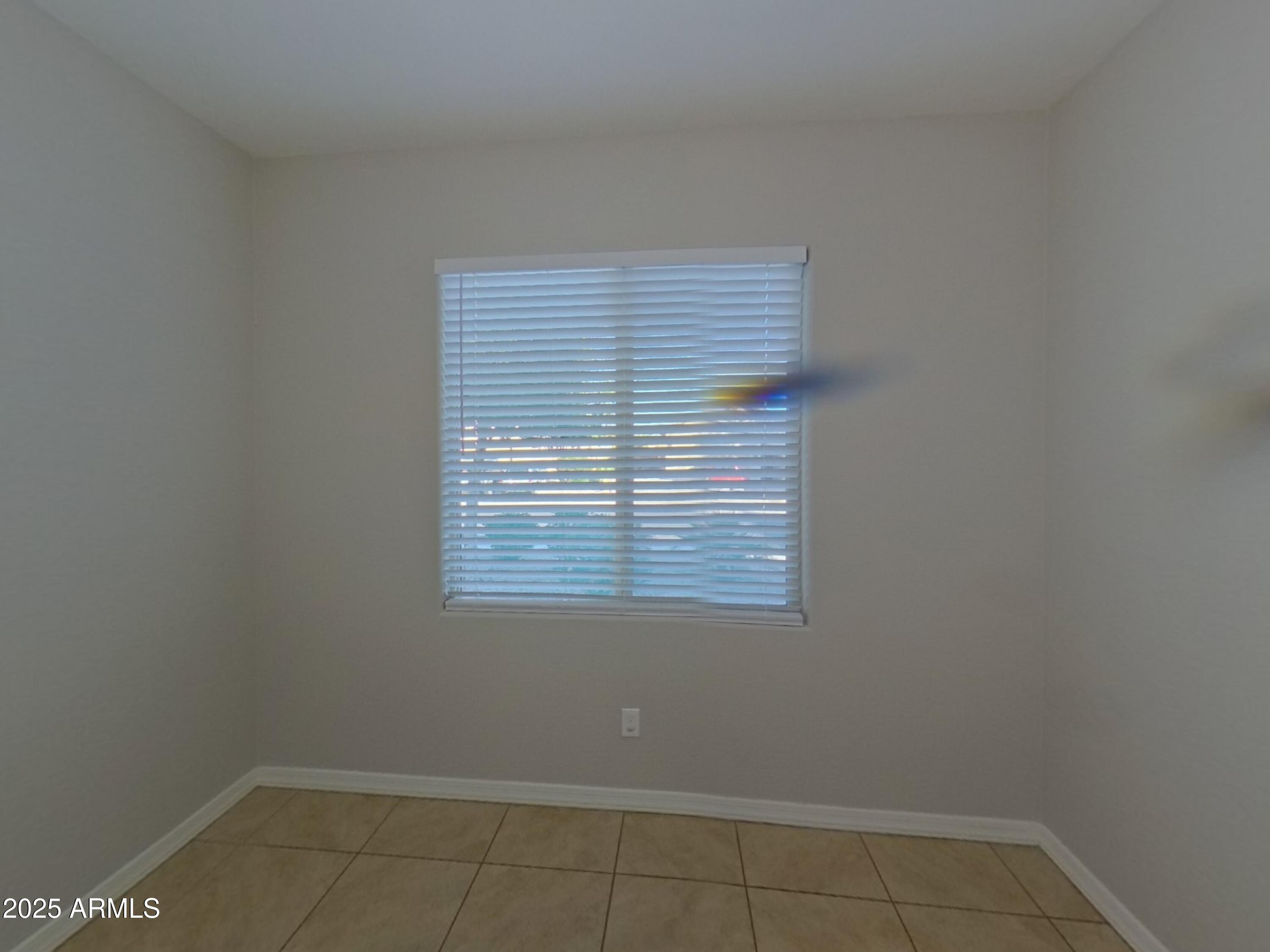 40209 Walker Way Maricopa, AZ 85138 - Photo 4 of 16 a view of an empty room with a window