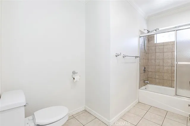 a bathroom with a granite countertop sink a mirror and a bathtub