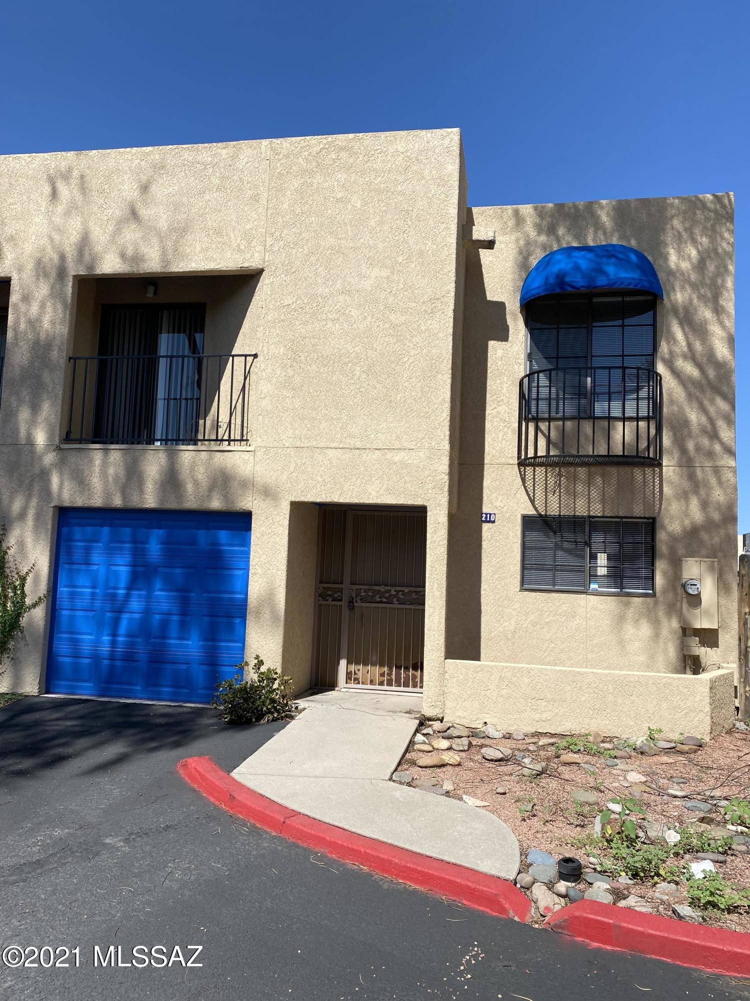 210 East Pastime Road Tucson, AZ 85705 - Photo 2 of 29 a view of a brick house with large windows