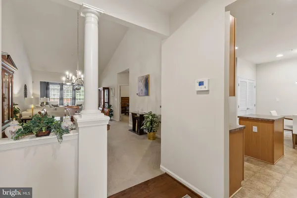 a living room with furniture and large windows