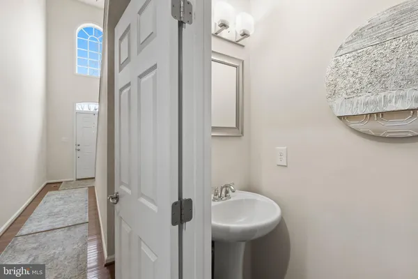 a utility room with dryer washer and a fridge