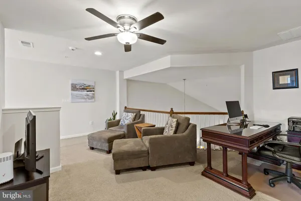 a living room with furniture and white walls