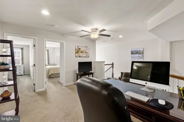 a bedroom with a bed and a couch