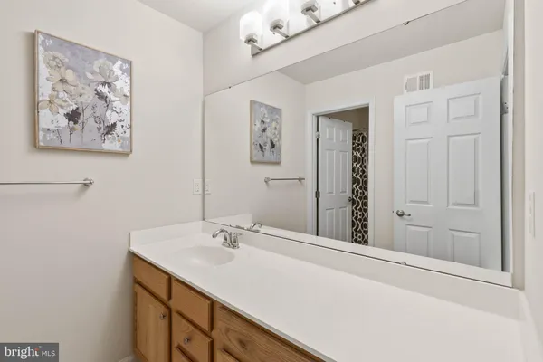 a bathroom with a shower curtain and a shower