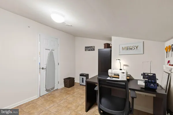 a living room with furniture a flat screen tv and furniture