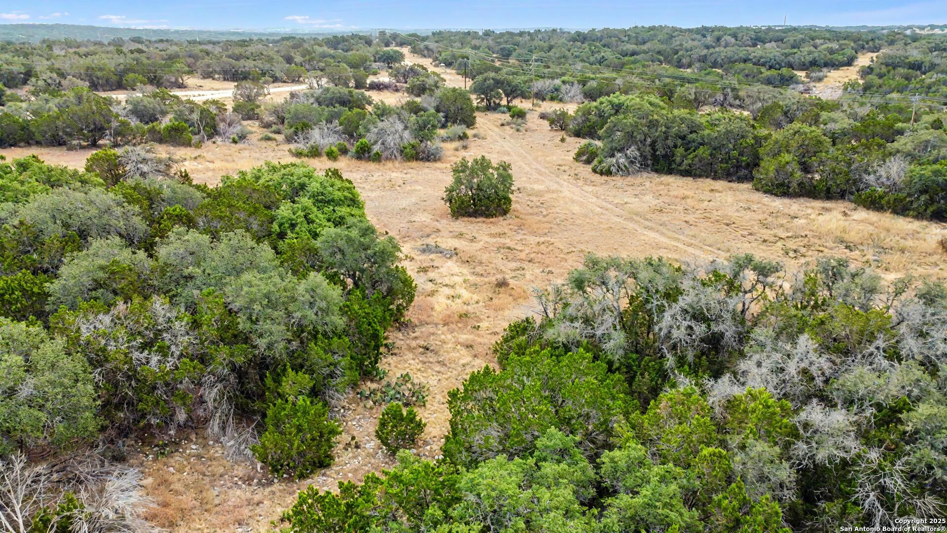 90 Tasiwoo Pvt Road Harper, TX 78631 - Photo 13 of 22 an aerial view of houses with yard