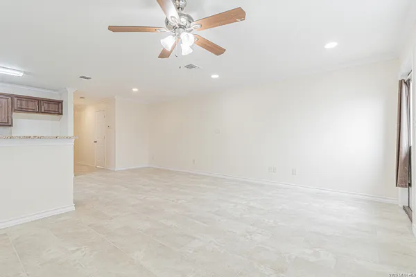 a view of kitchen with kitchen island dining table and chairs