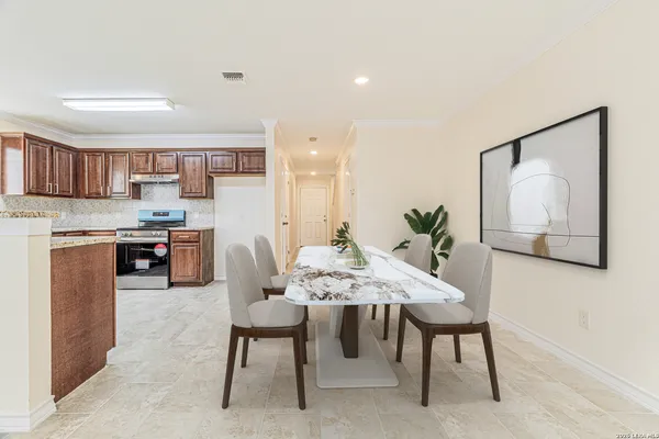 a view of kitchen with wooden cabinet