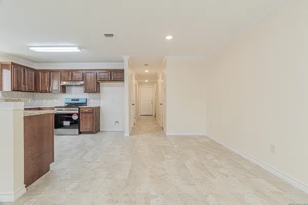 a kitchen with stainless steel appliances granite countertop a refrigerator sink and cabinets