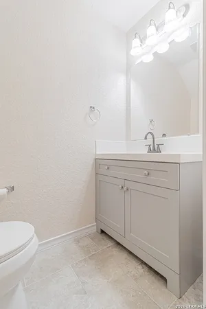 a bedroom with a bed and a table with chair