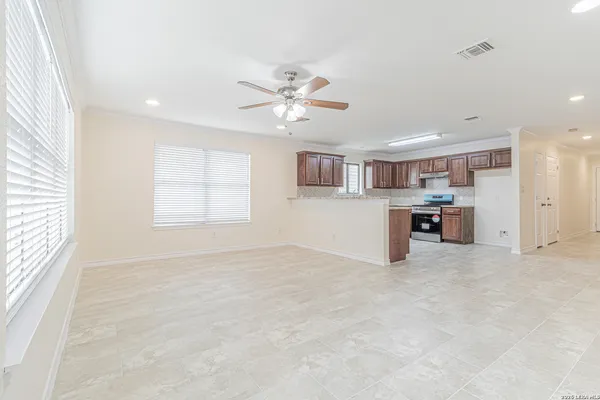 a view of an empty room with a window