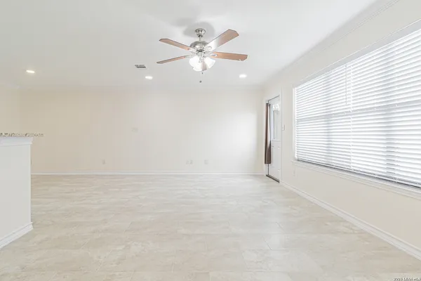 a view of a kitchen with a sink and cabinets