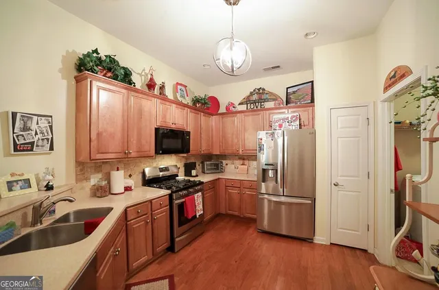 a living room with furniture a flat screen tv and a window