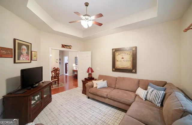 a bedroom with a bed and a chair