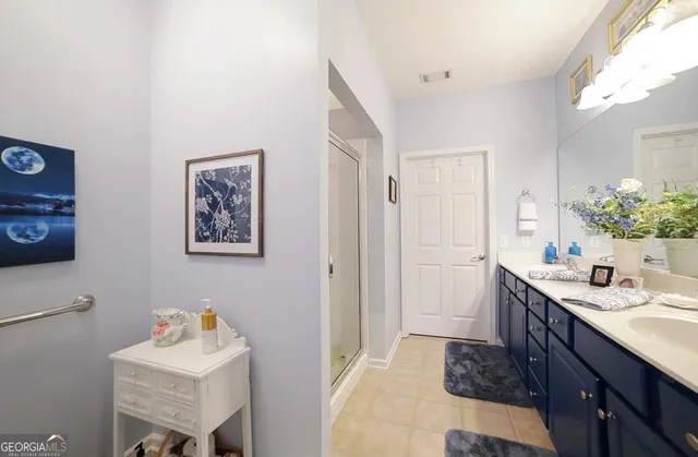 a bathroom with a double vanity sink and a mirror