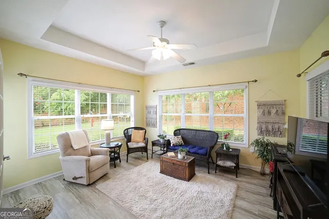 a living room with furniture or couch and a window
