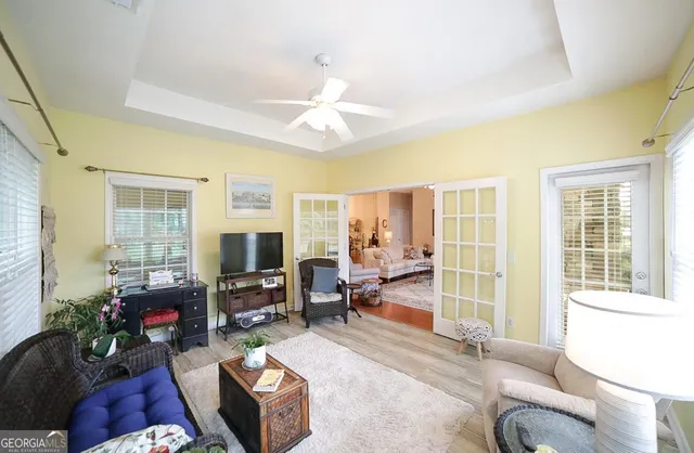 a dining room with furniture and window