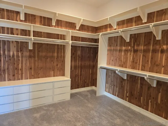 a view of an empty room with empty shelves