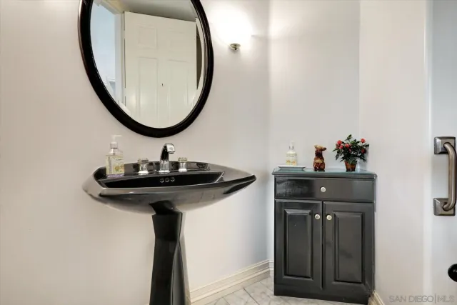 a utility room with cabinets washer and dryer