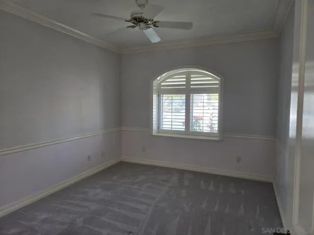 a bathroom with a toilet sink and shower