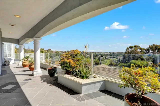 a view of a balcony with lake view and mountain view