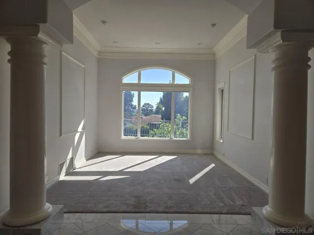 a view of a room that has a window in it