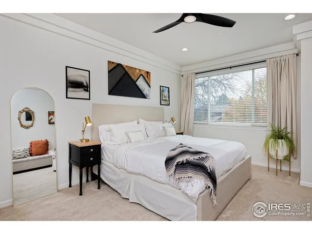 a bedroom with a bed and a couch