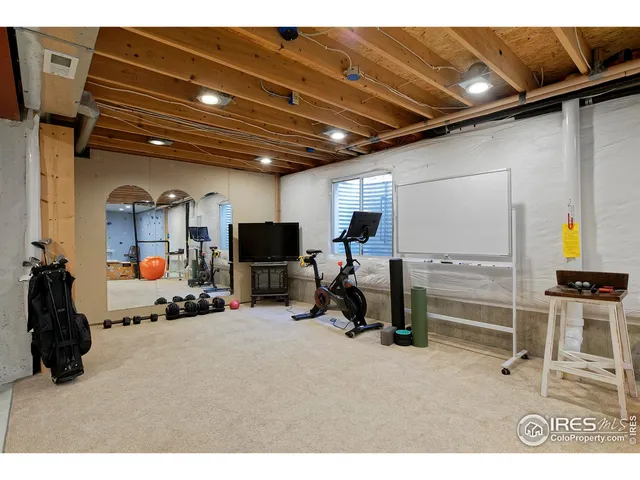 a workspace with furniture and wooden floor