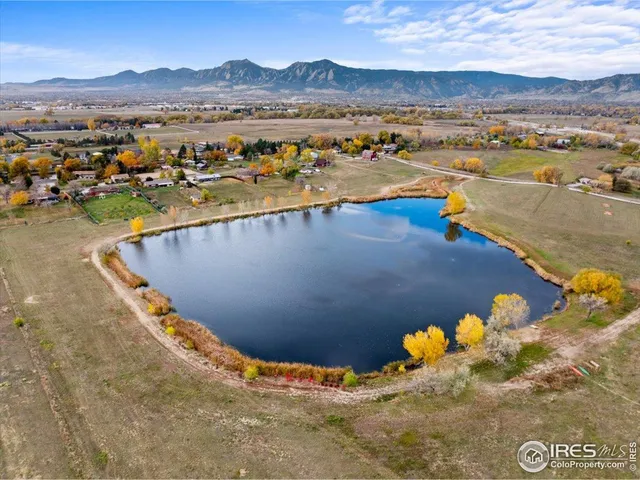 a aerial view of a house with a yard