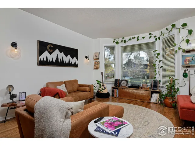 a view of a dining room with furniture wooden floor and chandelier
