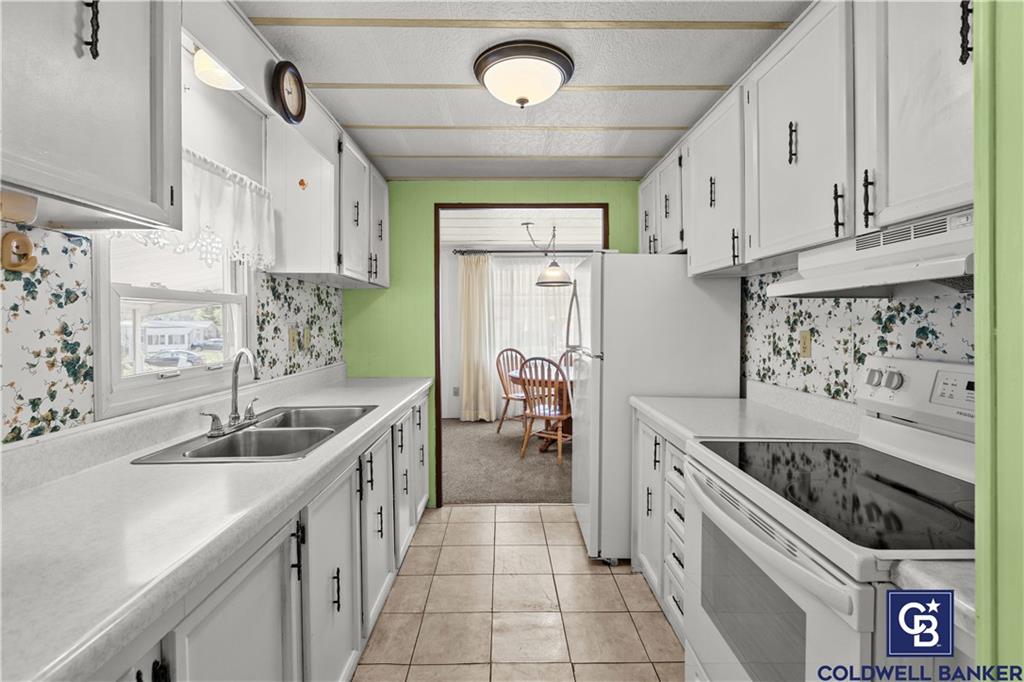 437 Blue Jay Lane Apollo, PA 15613 - Photo 11 of 30 a kitchen with stainless steel appliances granite countertop a sink and cabinets