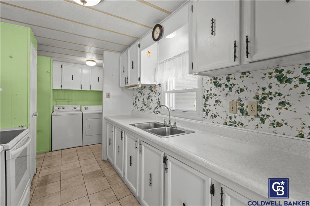 437 Blue Jay Lane Apollo, PA 15613 - Photo 12 of 30 a kitchen with a sink and cabinets