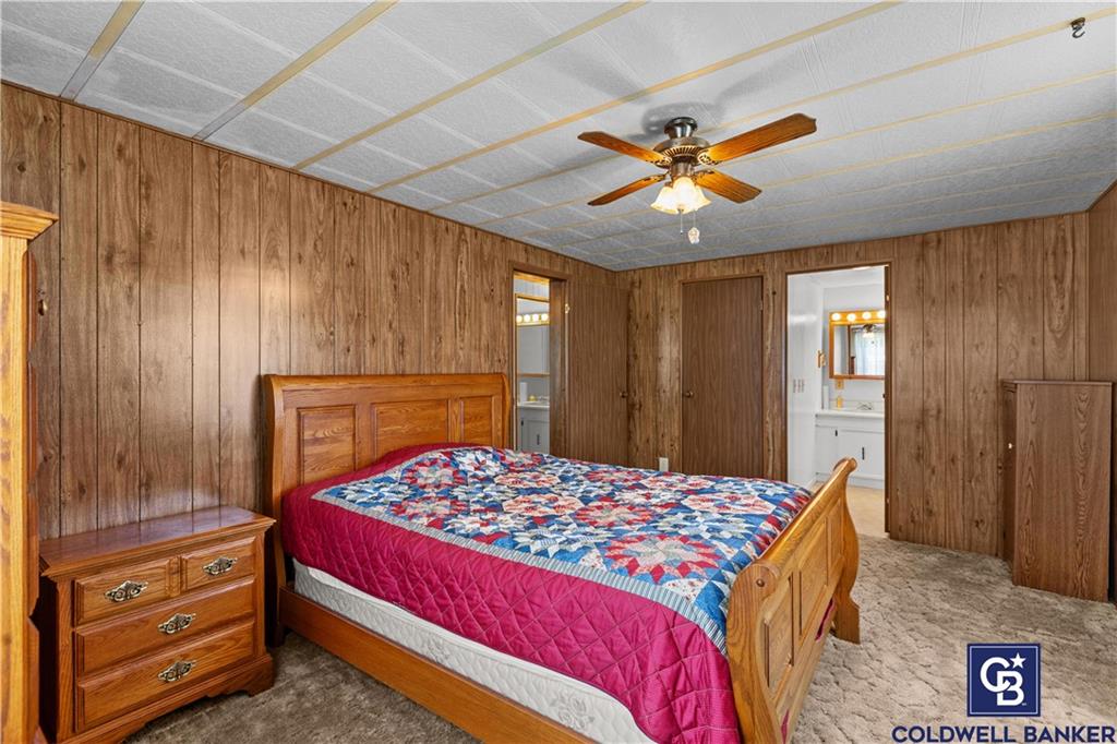 437 Blue Jay Lane Apollo, PA 15613 - Photo 20 of 30 a bedroom with a bed and a chandelier