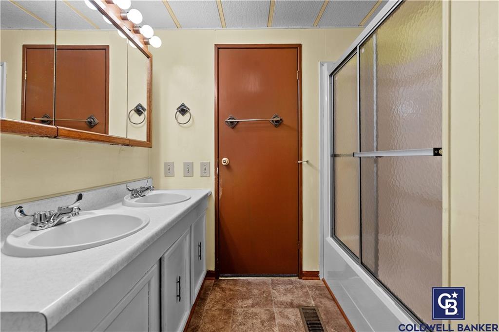 437 Blue Jay Lane Apollo, PA 15613 - Photo 27 of 30 a bathroom with a sink and a mirror