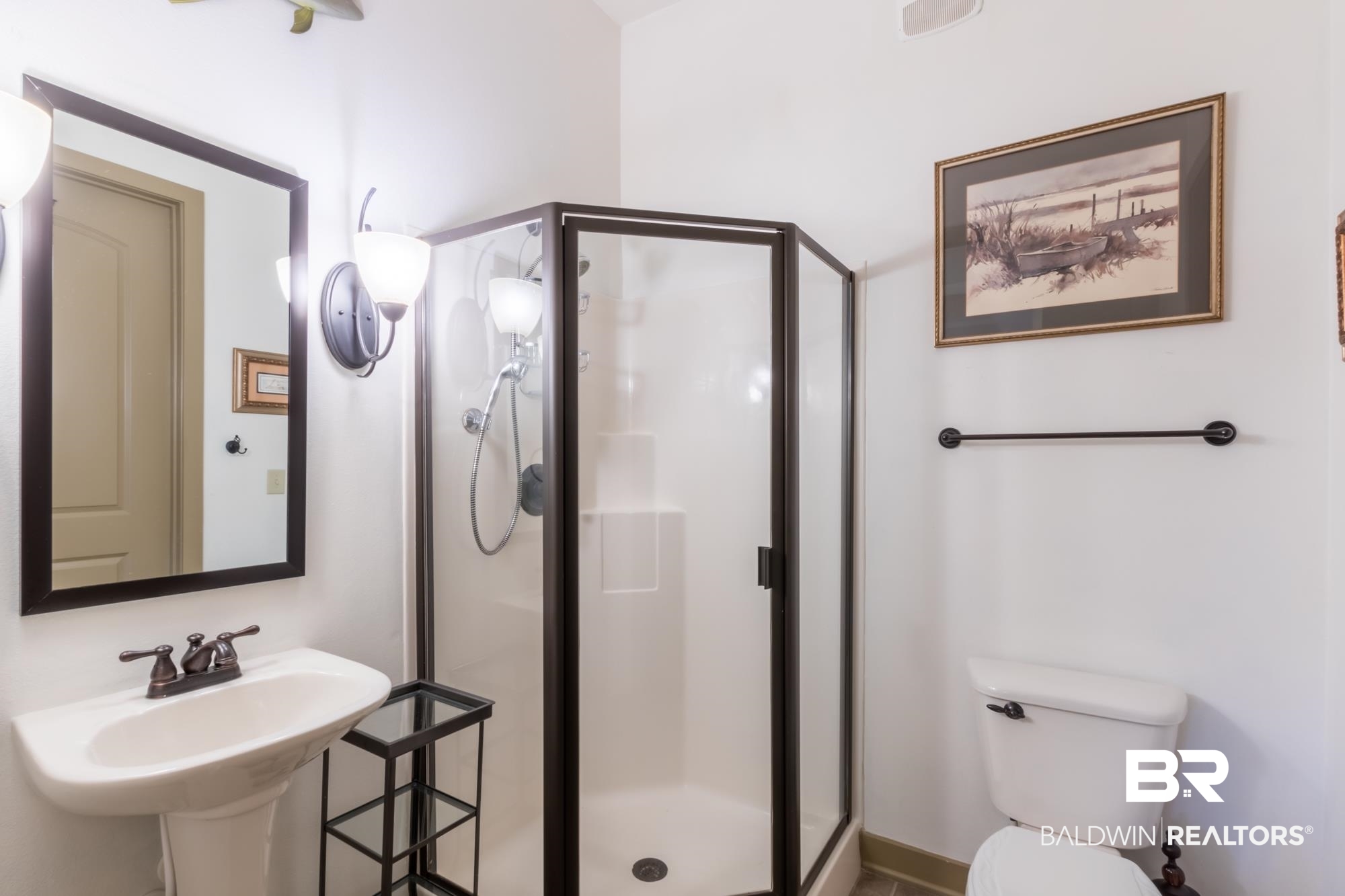 1430 Regency Road, Unit G103 Gulf Shores, AL 36542 - Photo 16 of 29 Bathroom featuring a shower with shower door and toilet