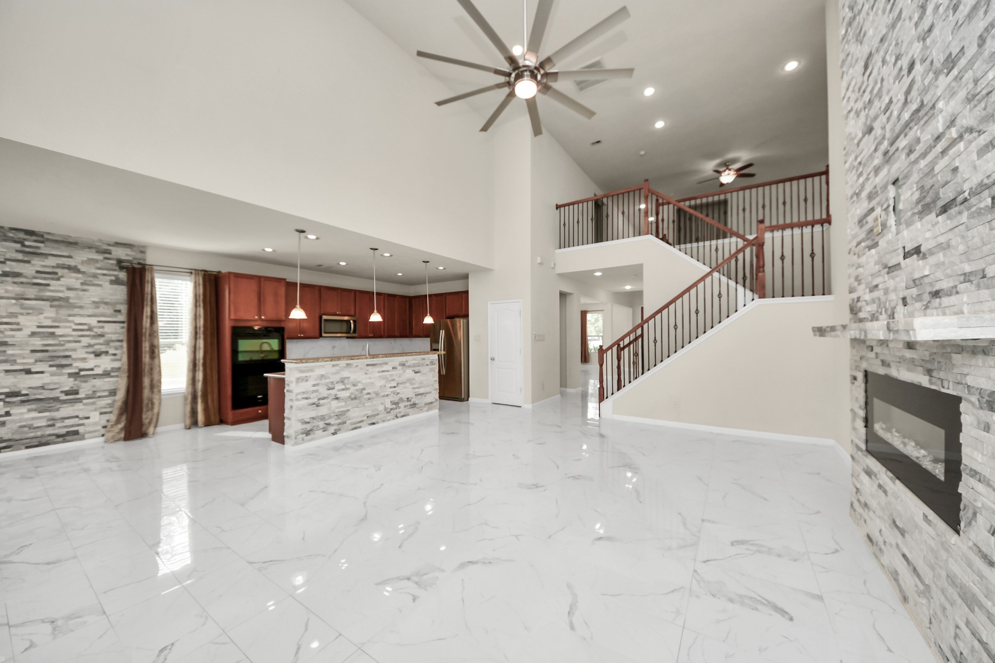 21119 Keystone Pine Court Katy, TX 77449 - Photo 43 of 43 The family room opens directly to the breakfast space and Chef's kitchen for the ultimate open-concept/entertainer's floor plan.