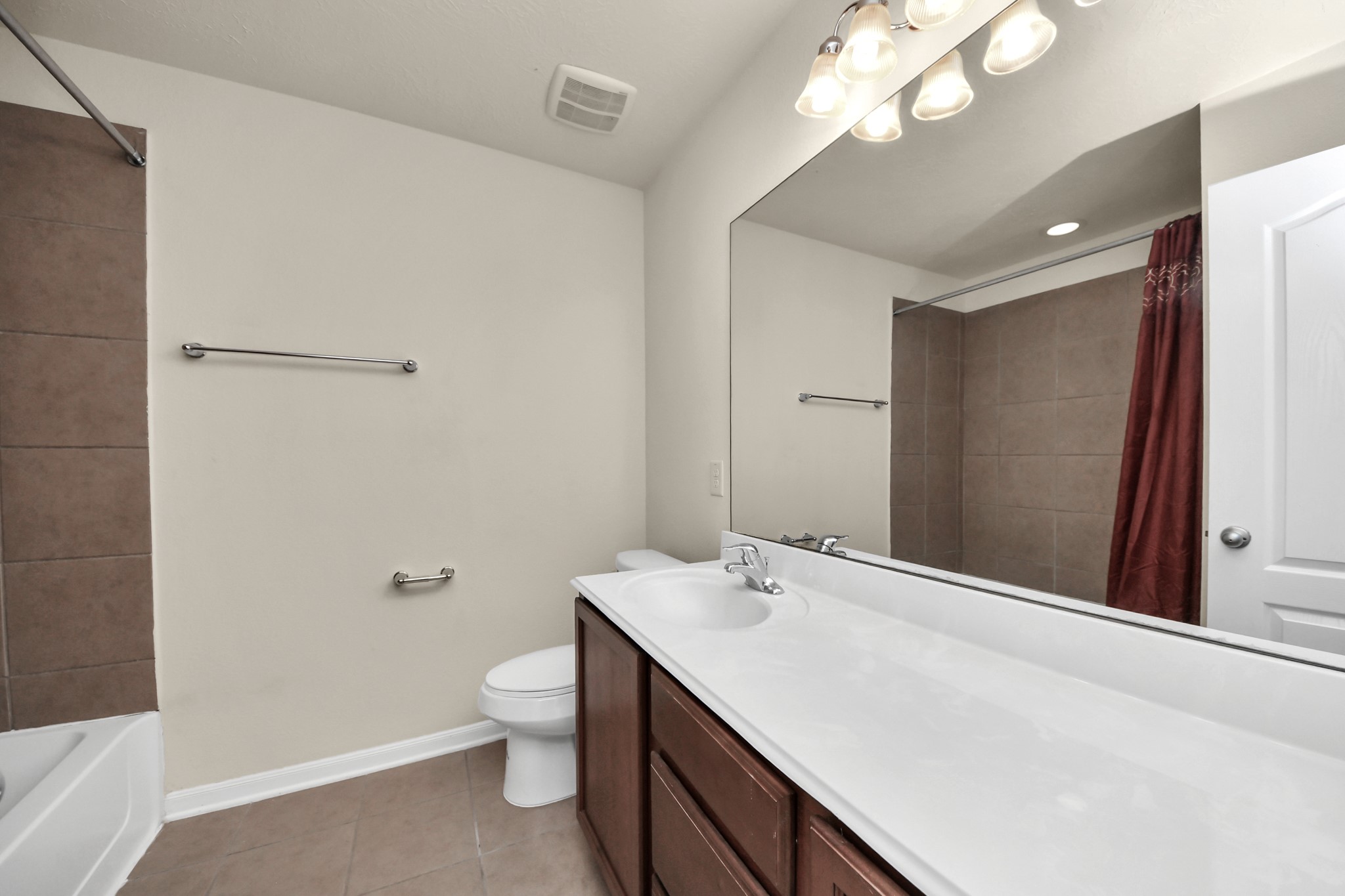 21119 Keystone Pine Court Katy, TX 77449 - Photo 36 of 43 The second full bathroom offers a huge sink vanity with tons of cabinet storage, an over-sized frame-less mirror, and versatile tub/shower combo - perfect for sharing!