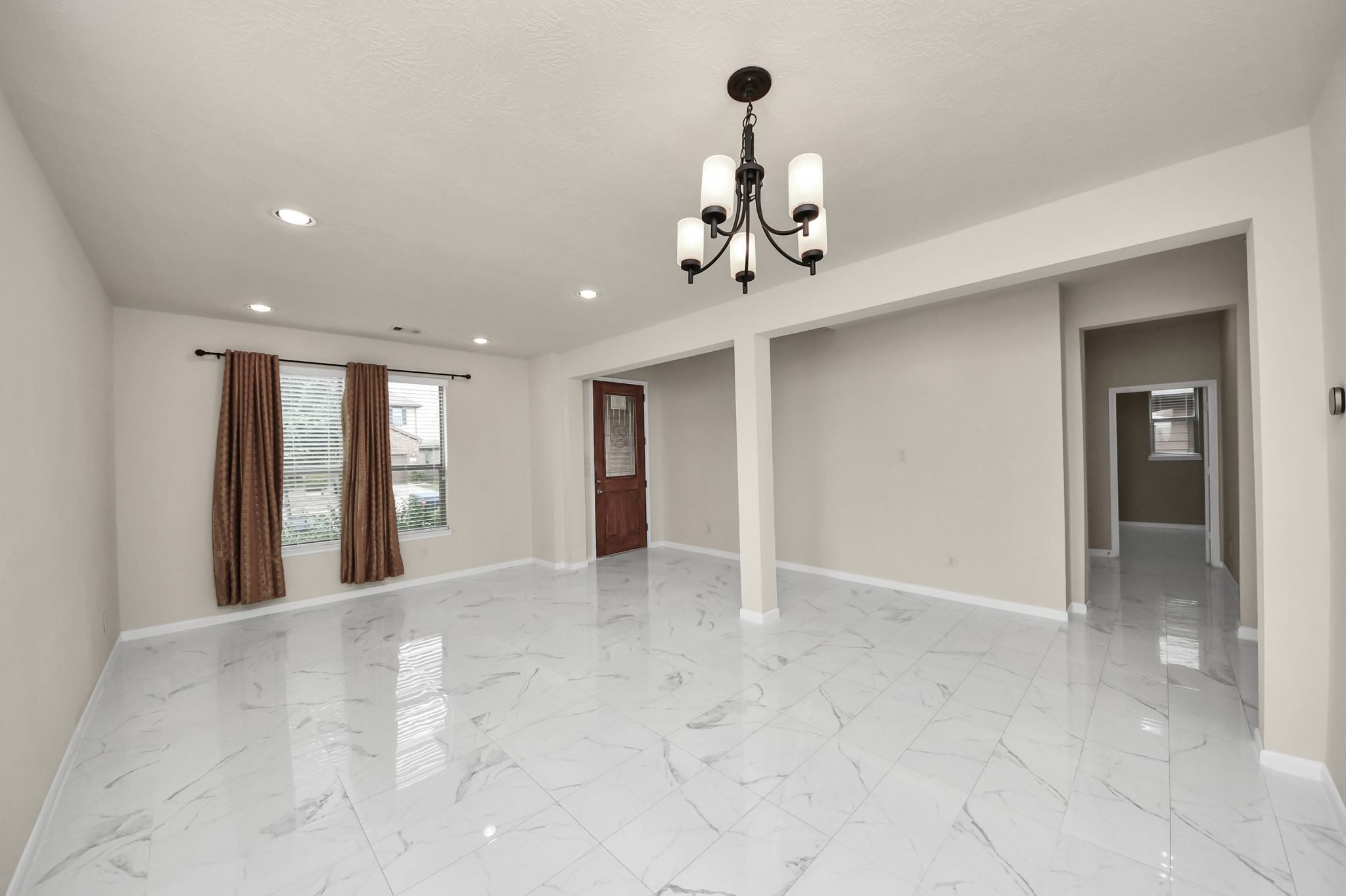 21119 Keystone Pine Court Katy, TX 77449 - Photo 8 of 43 Step inside the foyer to be greeted by nice tile floors, fresh designer paint, and soaring 2-story ceilings.