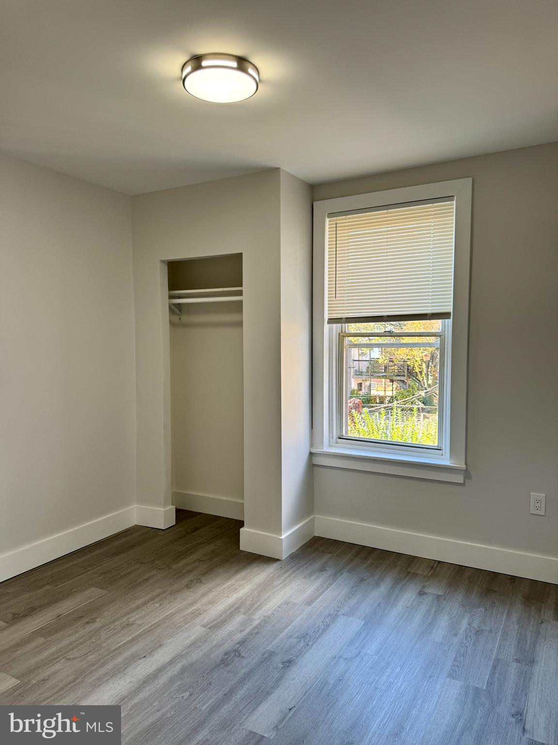 6308 North Lambert Street Philadelphia, PA 19138 - Photo 14 of 21 an empty room with wooden floor and windows