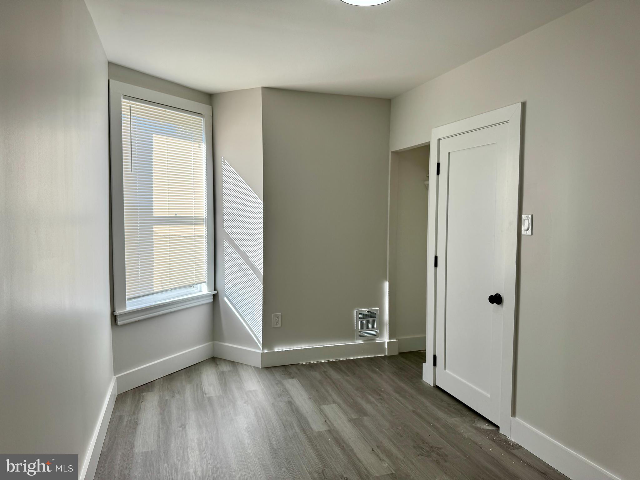 6308 North Lambert Street Philadelphia, PA 19138 - Photo 16 of 21 an empty room with wooden floor and windows