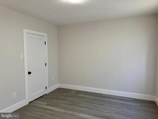 a view of a house with a tree