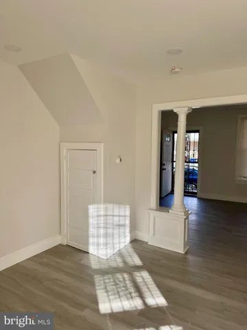 a kitchen with stainless steel appliances white cabinets and a sink