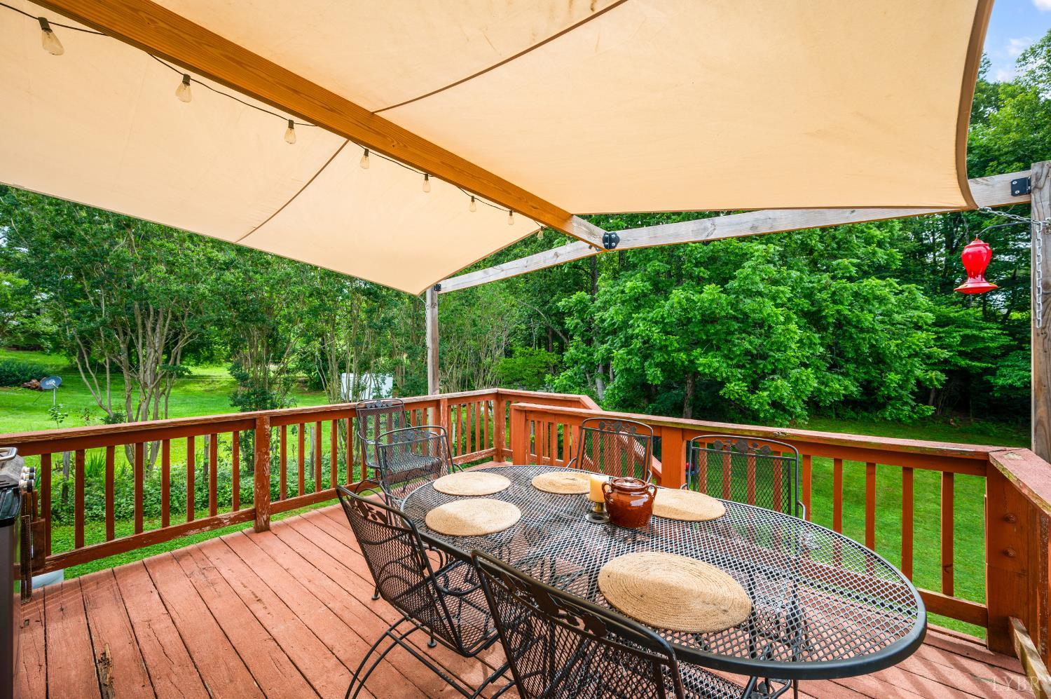 339 Thomas Road Madison Heights, VA 24572 - Photo 23 of 42 a balcony with wooden floor table and chairs