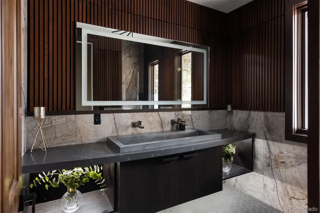 a bathroom with a sink and a mirror