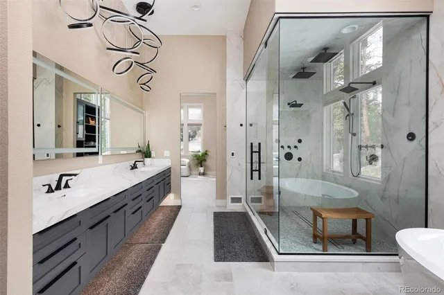 a spacious bathroom with a bathtub and next to a window