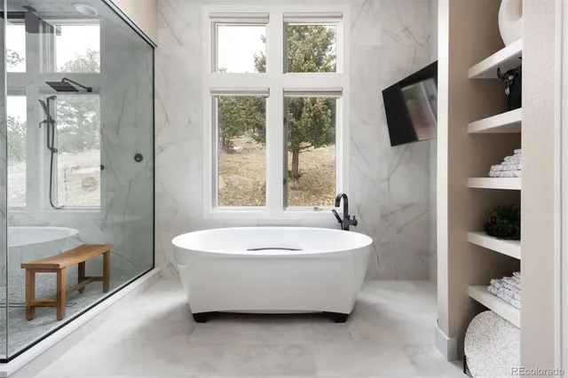 a kitchen that has a lot of cabinets in it
