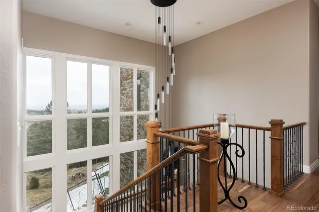 a very nice looking room with many windows and furniture